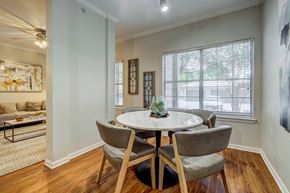 Austin apartment for rent - A dining room with a round table and chairs.
