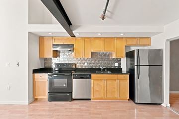 San Francisco apartment for rent - A modern kitchen with wooden cabinets and stainless steel appliances.