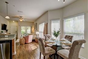 Lutz apartment for rent - A dining room with a table set for four.