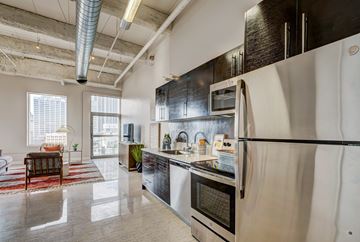 Los Angeles apartment for rent - A modern kitchen with stainless steel appliances and a large island.