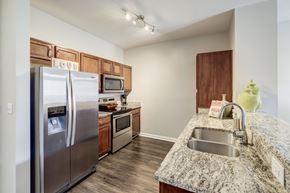 Atlanta apartment for rent - A kitchen with a granite counter top and stainless steel appliances.