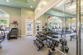 Westborough apartment for rent - A gym with a variety of equipment including treadmills, weights, and exercise machines.