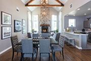 Snoqualmie apartment for rent - A dining room with a fireplace and grey chairs.