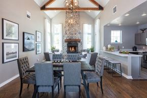 Snoqualmie apartment for rent - A dining room with a fireplace and grey chairs.