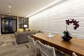 Charlestown apartment for rent - A modern dining room with a wooden table and chairs.