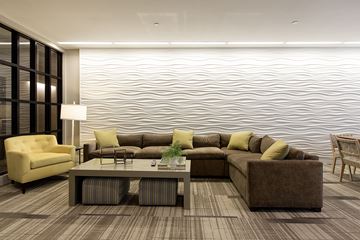 Charlestown apartment for rent - A modern living room with a large sectional sofa and a coffee table.