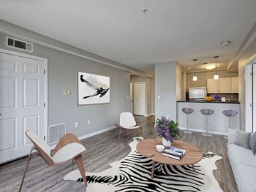 Quincy apartment for rent - a living room with a zebra rug and a table