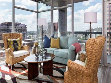 Chicago apartment for rent - a living room with a couch and a table in front of a window