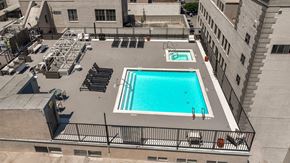 Los Angeles apartment for rent - A small pool on a balcony surrounded by black railings.