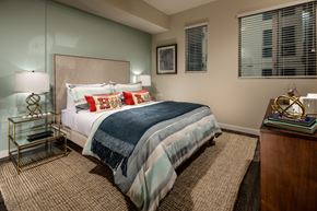 Los Angeles apartment for rent - A bedroom with a bed, nightstand, and lamp.