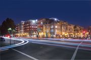 Walnut Creek apartment for rent - A long exposure shot of a city street at night with light trails from moving vehicles.
