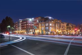 Walnut Creek apartment for rent - A long exposure shot of a city street at night with light trails from moving vehicles.