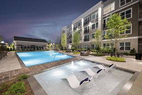 Plymouth apartment for rent - A swimming pool with a slide in the middle of it.