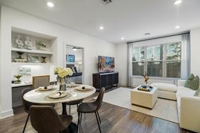 Plymouth apartment for rent - A modern dining room with a round table and chairs.
