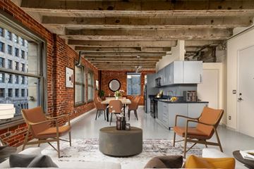 Los Angeles apartment for rent - A modern kitchen with a dining table and chairs.
