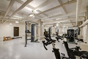 Los Angeles apartment for rent - A gym with a variety of exercise equipment including treadmills, stationary bikes, and weight machines.