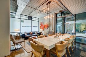 Los Angeles apartment for rent - A modern dining room with a long table and chairs.