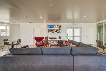 Los Angeles apartment for rent - A living room with a grey couch and a painting on the wall.