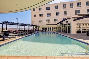 Los Angeles apartment for rent - A large indoor swimming pool with a building in the background.