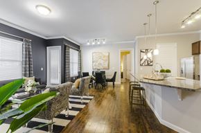 Aubrey apartment for rent - A modern dining room with a wooden table and chairs.