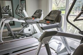 Dublin apartment for rent - A treadmill and a stationary bike are in a gym.