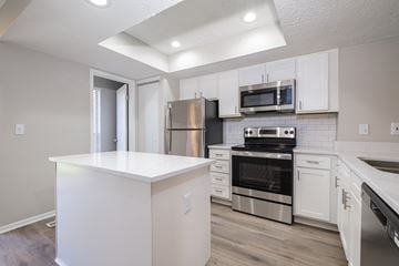 Dublin apartment for rent - A kitchen with white cabinets and stainless steel appliances.