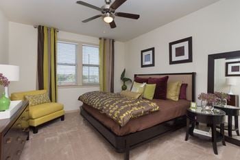 Beautiful bright bedroom with wide windows