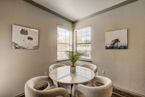 Westminster apartment for rent - A dining room with a white table and chairs.