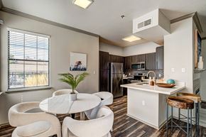 Westminster apartment for rent - A kitchen with a table and chairs in front of a window.
