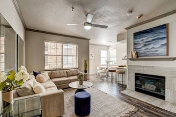 Westminster apartment for rent - A living room with a fireplace and a painting on the wall.