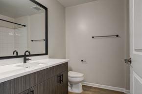 Hackensack apartment for rent - A bathroom with a toilet, sink, and towel bar.