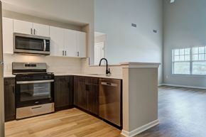 Hackensack apartment for rent - A kitchen with a stainless steel oven and microwave above it.
