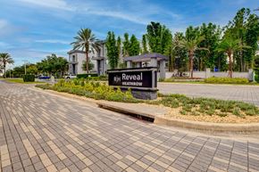 Heathrow apartment for rent - A sign that says RIH Reveal HEATHROW in front of a building.