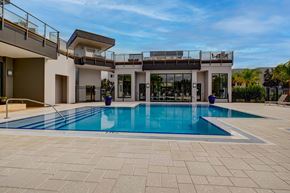 Heathrow apartment for rent - A modern house with a swimming pool in the backyard.