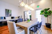 Jupiter apartment for rent - A dining room with a wooden table and chairs.