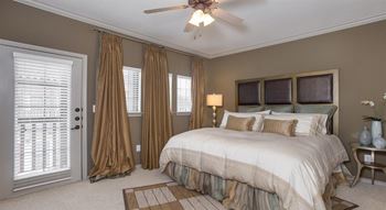 Beautiful bright bedroom with wide windows