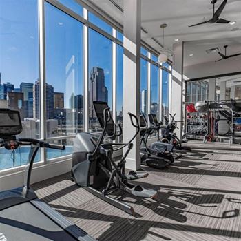 Full fitness club featuring a cell phone lounge and yoga/trx studio