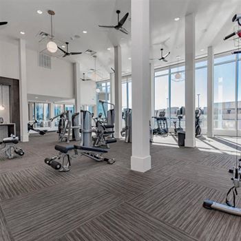 Full fitness club featuring a cell phone lounge and yoga/trx studio