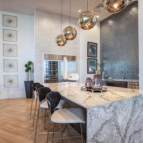 Dallas apartment for rent - resident entertaining kitchen at The Gabriella apartments