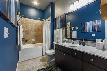 Spacious bathrooms with large soaking tubs and tile surrounds