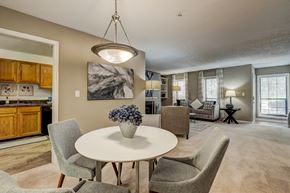 Smyrna apartment for rent - A modern dining room with a round table and chairs.