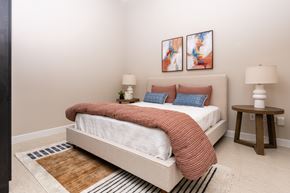 Los Angeles apartment for rent - A bedroom with a large bed and two lamps.
