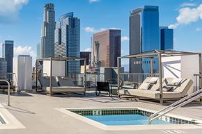 Los Angeles apartment for rent - A pool area with a view of the city skyline.