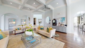 Aubrey apartment for rent - A spacious living room with a glass coffee table and a white sofa with yellow pillows.