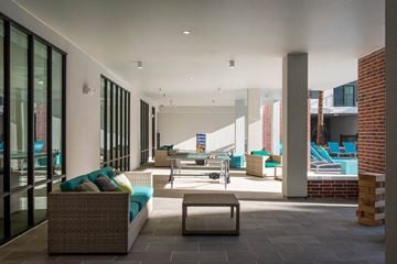 Houston apartment for rent - a living room with a couch and a table     and a pool