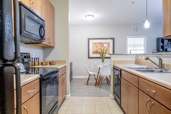 Kitchens with built-in microwave and whirlpool flat-top range