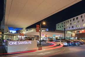 Los Angeles apartment for rent - A parking lot with cars and a sign that says "ONE SANTA FE".