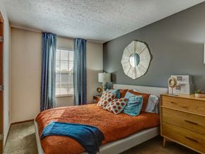 Columbus apartment for rent - a bedroom with a bed and a mirror