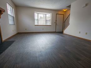 Columbus apartment for rent - an empty living room with wood floors and a window