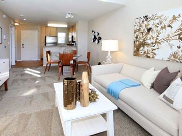 San Jose apartment for rent - a living room with a white couch and a table